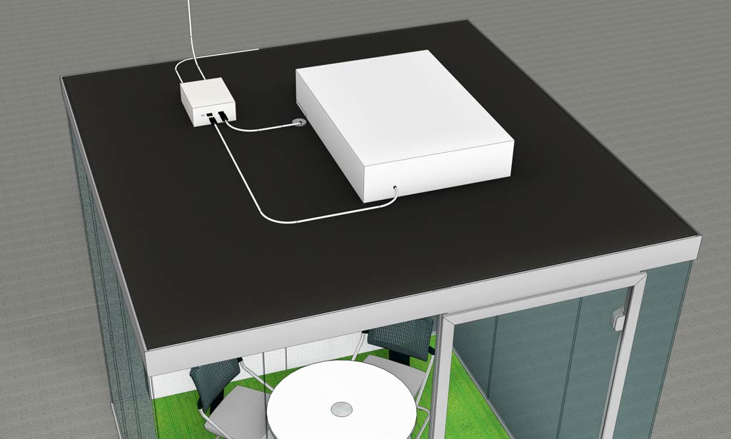 Picture of a room in room unit diagonally from above with control box on the ceiling element.